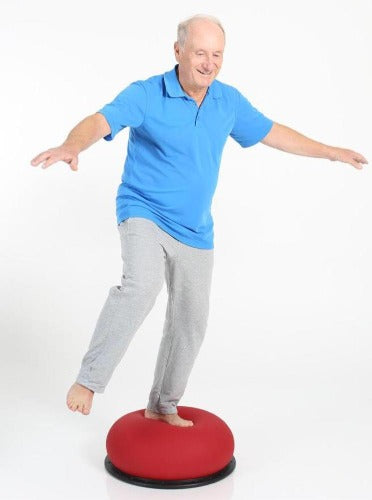 Senior citizen doing balance training on TOGU Jumper