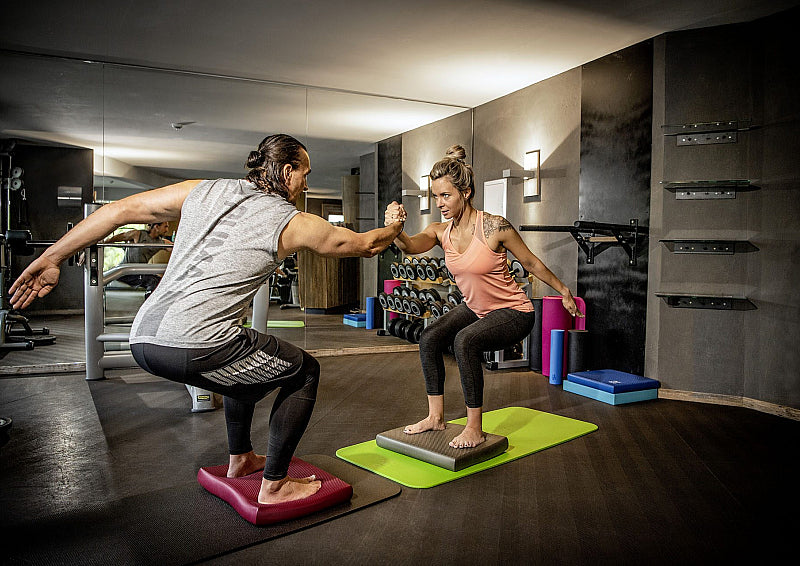 Group exercising on airex fitline mats