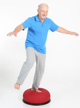 Load image into Gallery viewer, Senior citizen doing balance training on TOGU Jumper
