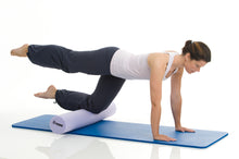 Load image into Gallery viewer, Woman exercising on TOGU Pilates Foam Roller Premium
